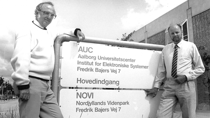 Jørgen Bach Andersen, AAU and Knud Rindum, NOVIs first Man. director standing by the first NOVI sign in 1989..